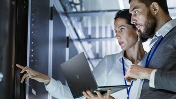 people using laptop in datacenter