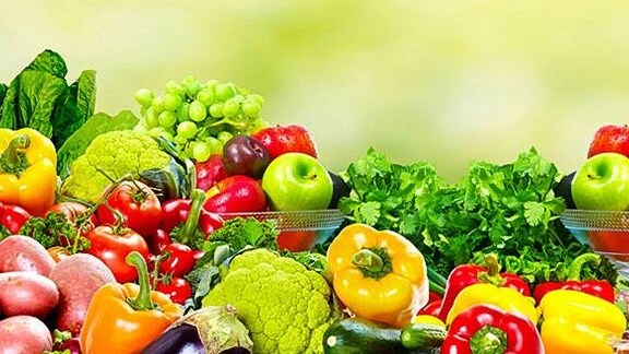 Assorted fresh fruits and vegetables displayed together.